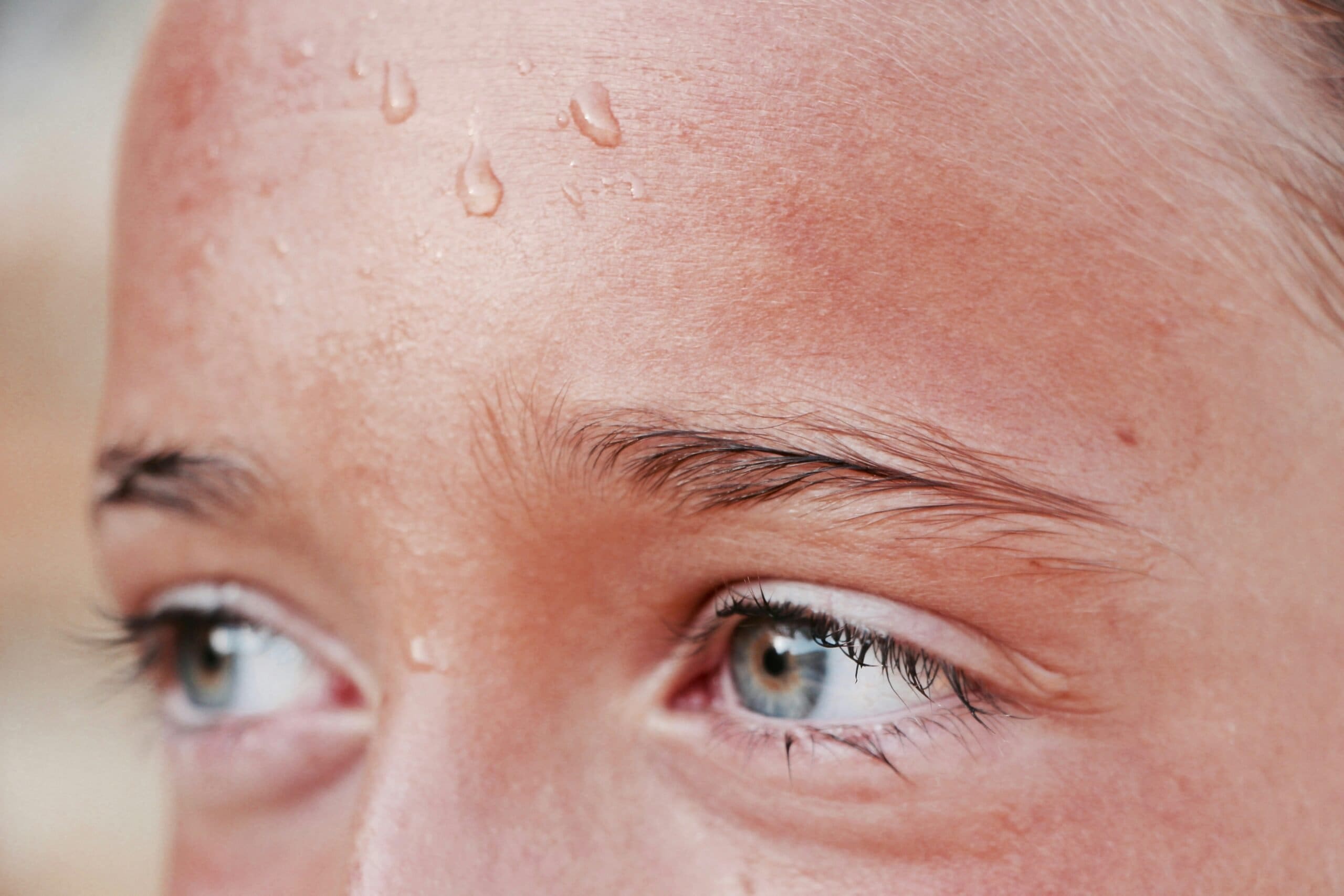 Climate change myths Rising temperatures the sweaty forehead of a woman