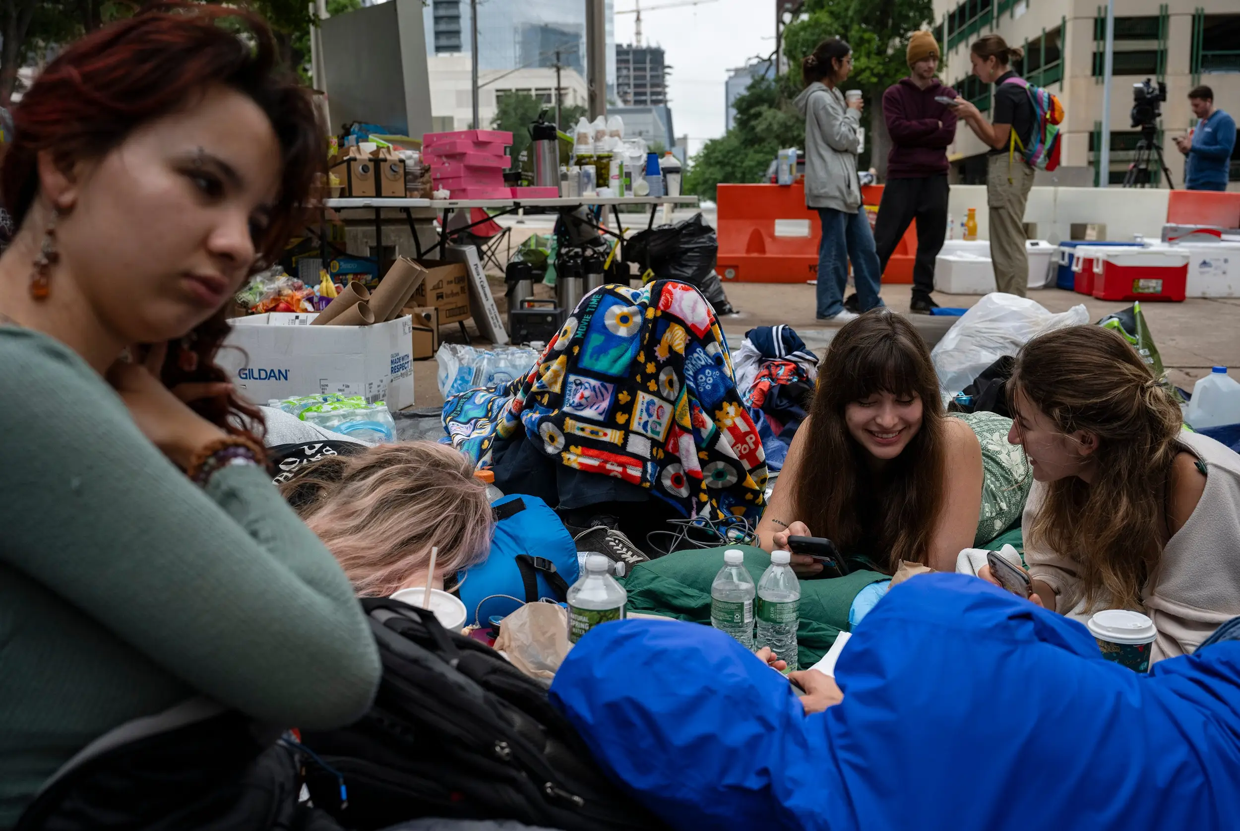 From left, University of Texas at Austin students Ana Maria, Piper Leleux, Daniella Alfonso and Eliza Sommers camp outside of the Travis County Jail on Tuesday, April 30, 2024, as they await the release of pro-Palestinian protesters who were arrested Monday from an encampment on the UT-Austin campus