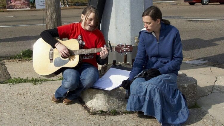 Women sing at a protest against the overturning of Roe v Wade