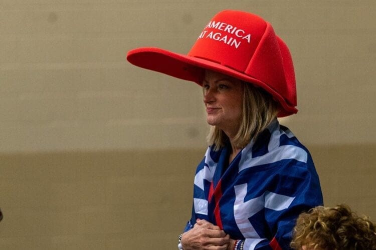 Woman wearing an oversized red MAGA hat in Florid