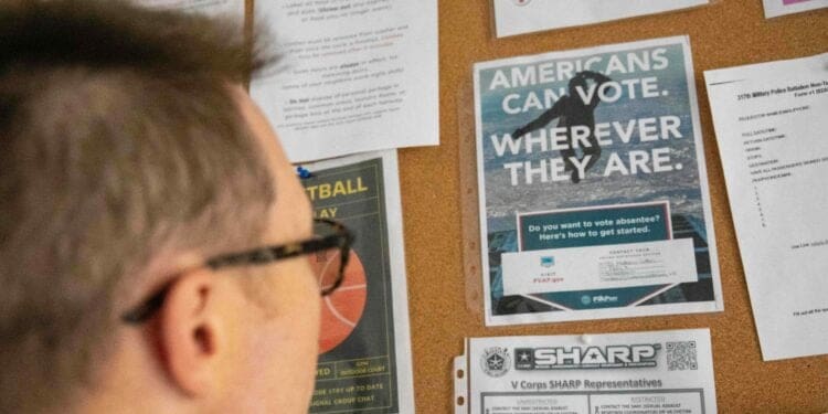 A voting pamphlet on a board at the U.S. Army's Camp Kosciuszko, Poland